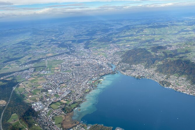 Private helicopter flight to Stockhorn mountain, with view to the Swiss Alps - Niesen’s pyramid profile and the triangular shadow trick
