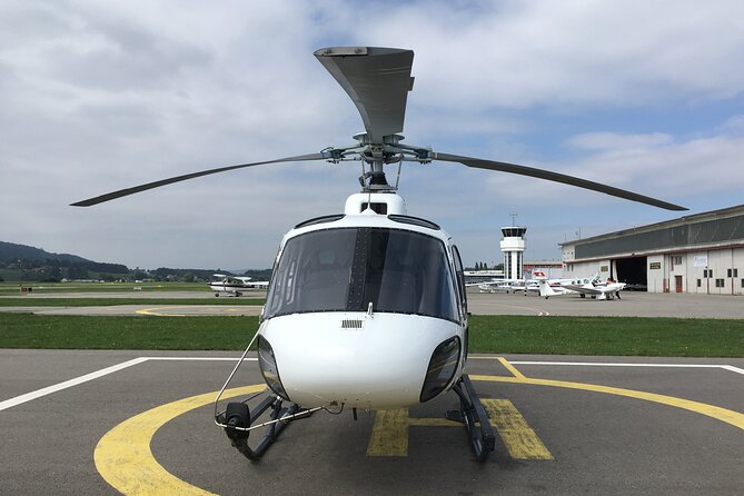 Private helicopter flight to Stockhorn mountain, with view to the Swiss Alps - From Bern-Belp over Lake Thun, the lake color is the first surprise