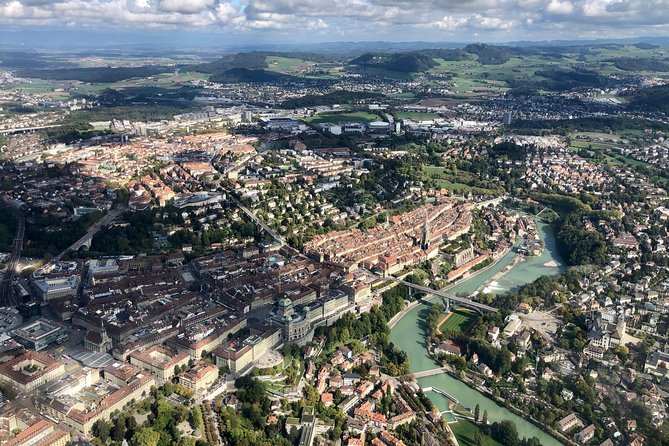 Swiss Capital city helicopter sightseeing tour - the ideal flight to see Berne - The first flight view: Bern old town alleys and the Aare horseshoe