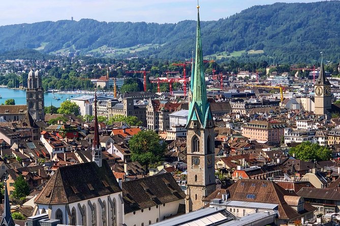 Zurich Highlights In A 2+ Hour Walking Tour Including Panoramic Views - Grossmünster Tower Views and the Included Funicular Ticket