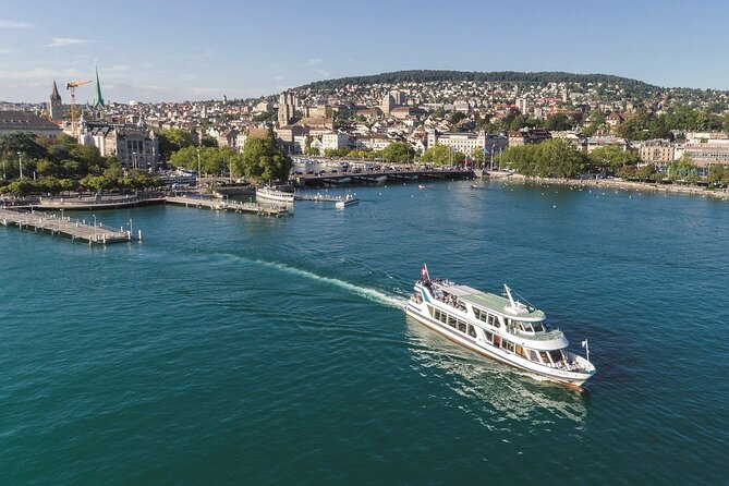 Zurich Highlights with Lake Cruise & Optional FIFA Museum Ticket - Old Town walking tour in 25 minutes: St. Peter and Fraumünster